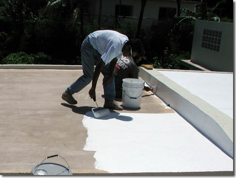 Roofer installing slate roof in Santa Ana, CA.